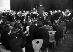 Theresienstadt, Czechoslovakia, 1944, A concert in the concert hall in the ghetto from a propaganda film. 8997763038122278063.jpg